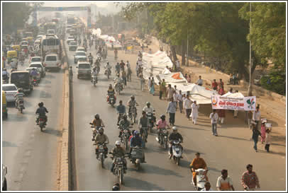 Five strips of the Hindi text are marched by 60 students each from various religious centers to the Gandhi Ashram.