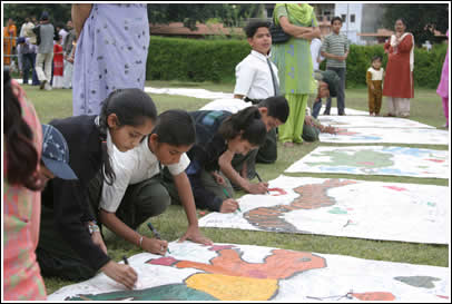 School kids signed the border pieces of The World's Largest Love Letter. Each of the 196- 6 ft. x 6 ft. border pieces were designed to create school-to-school penpal relationships.  