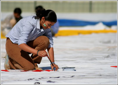 Girl paints on canvas.