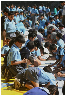 School children sign the letter.