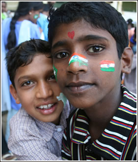 Boy shows off his face paint.