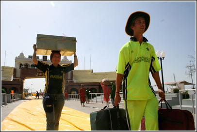 Jocelyn and John the stewardess, donning the Pakistani cricket team uniform, cross over The Golden Bridge of Friendship, carrying letters back for the kids of India. 