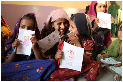 Giggling girls of Kutch show their friendship letters. 