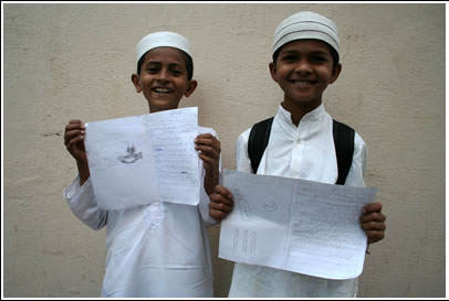 Two Muslim boys show their friendship letters. There are more Muslims in India than there are in Pakistan! 