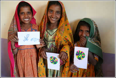 Rajasthani girls show their beautiful artwork on their letters. 