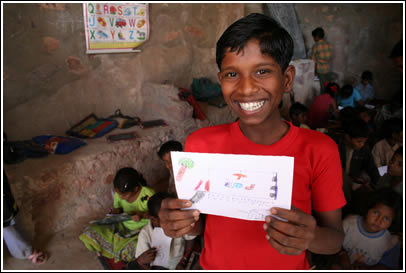 Boy proudly reveals his letter. 