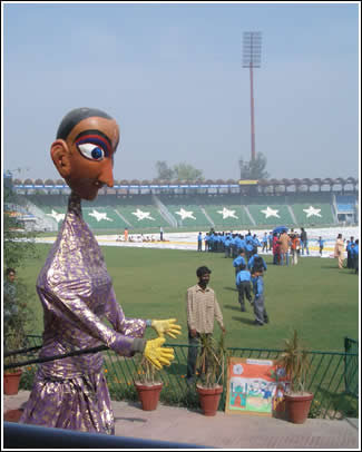 The gift of the World's Largest Love Letter is presented to the kids in Pakistan at Gaddafi Cricket Stadium in Lahore. 