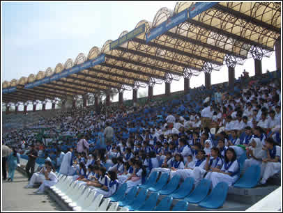 The beautiful Gaddafi Stadium bleachers were filled with thousands of Pakistani school children. 