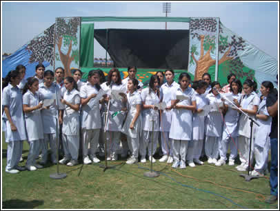 A group of high school girls sing a peace song as a gift of love back to India. 