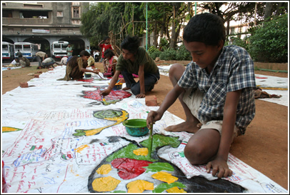 At Allana High School street kids help paint the border tarps too.