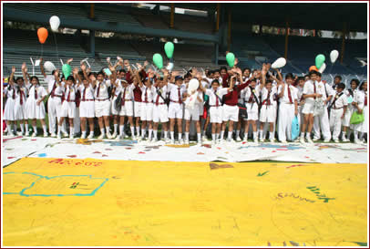 Students prepare for the balloon launch - sending messages of friendship up into the air with their names and school addresses on the backs. 