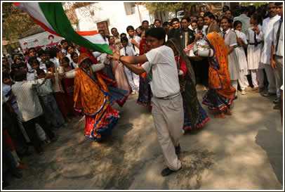 Kutchi dancers and a flag bearer rejoice in the name of friendship!